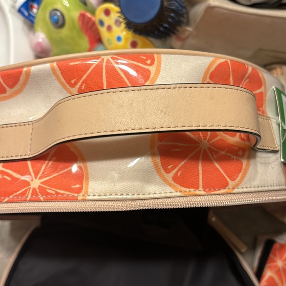 Kate Spade 11” clutch NWT. The only flaw is a small water mark under plastic. - Picture 10 of 16